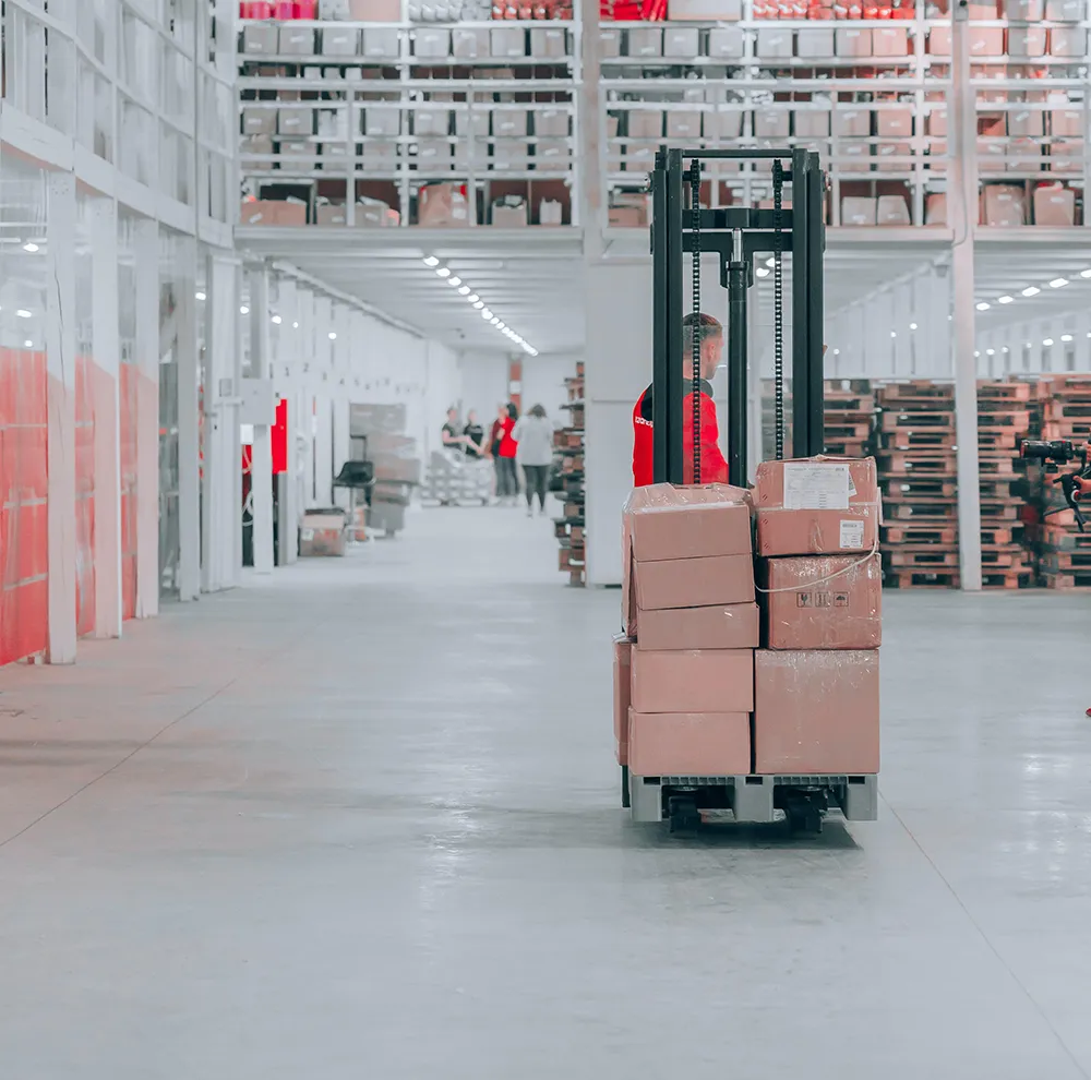 https://nationaldeliverysolutions.com/wp-content/uploads/2022/09/warehouse-with-forklift.webp